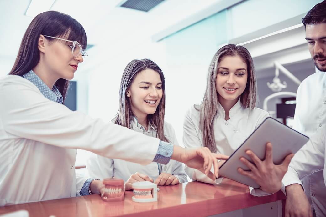 Young Medical Team Have Small Meeting at Clinics Reception