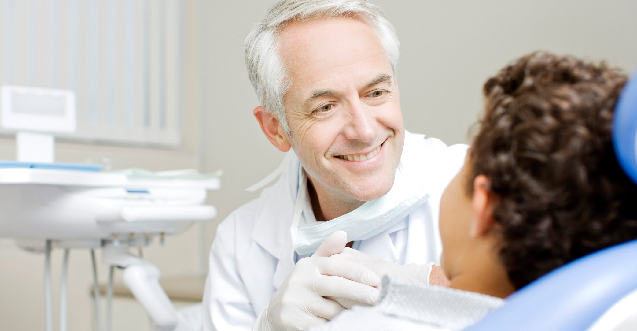 Dentist examining boys teeth dentist-examination