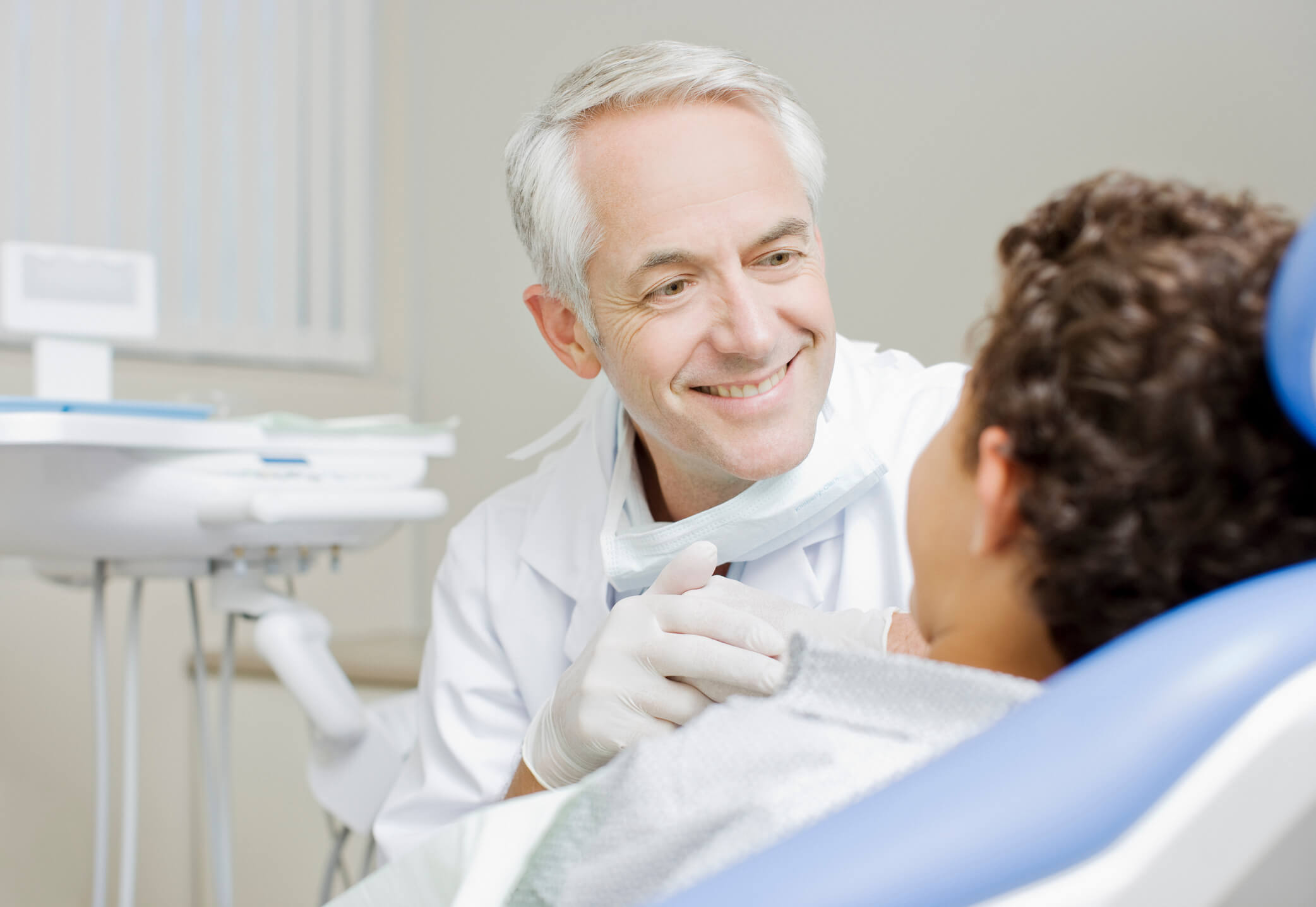 Dentist examining boys teeth dentist-examindation