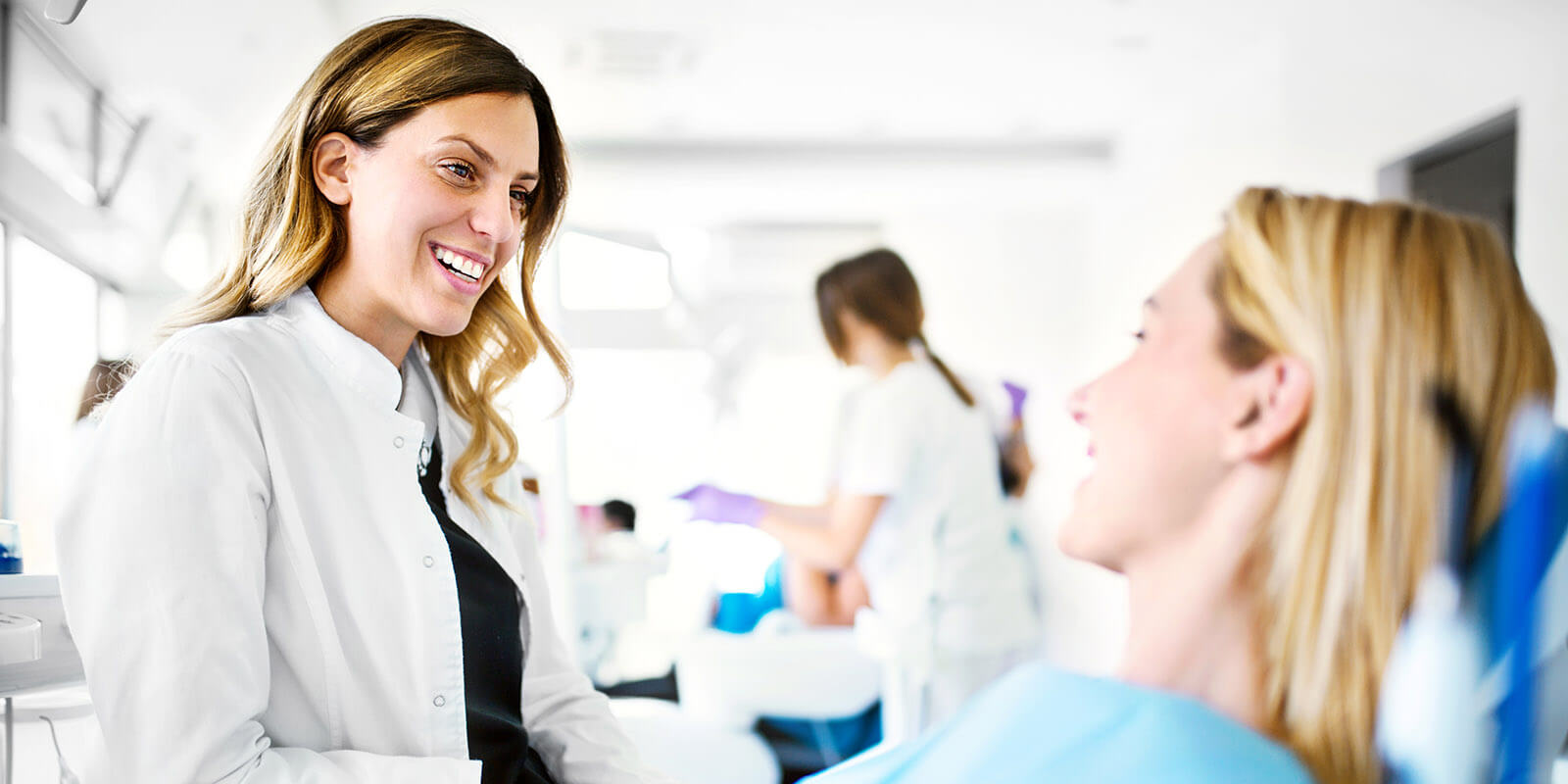 hygienist dental hygienist talking with patient